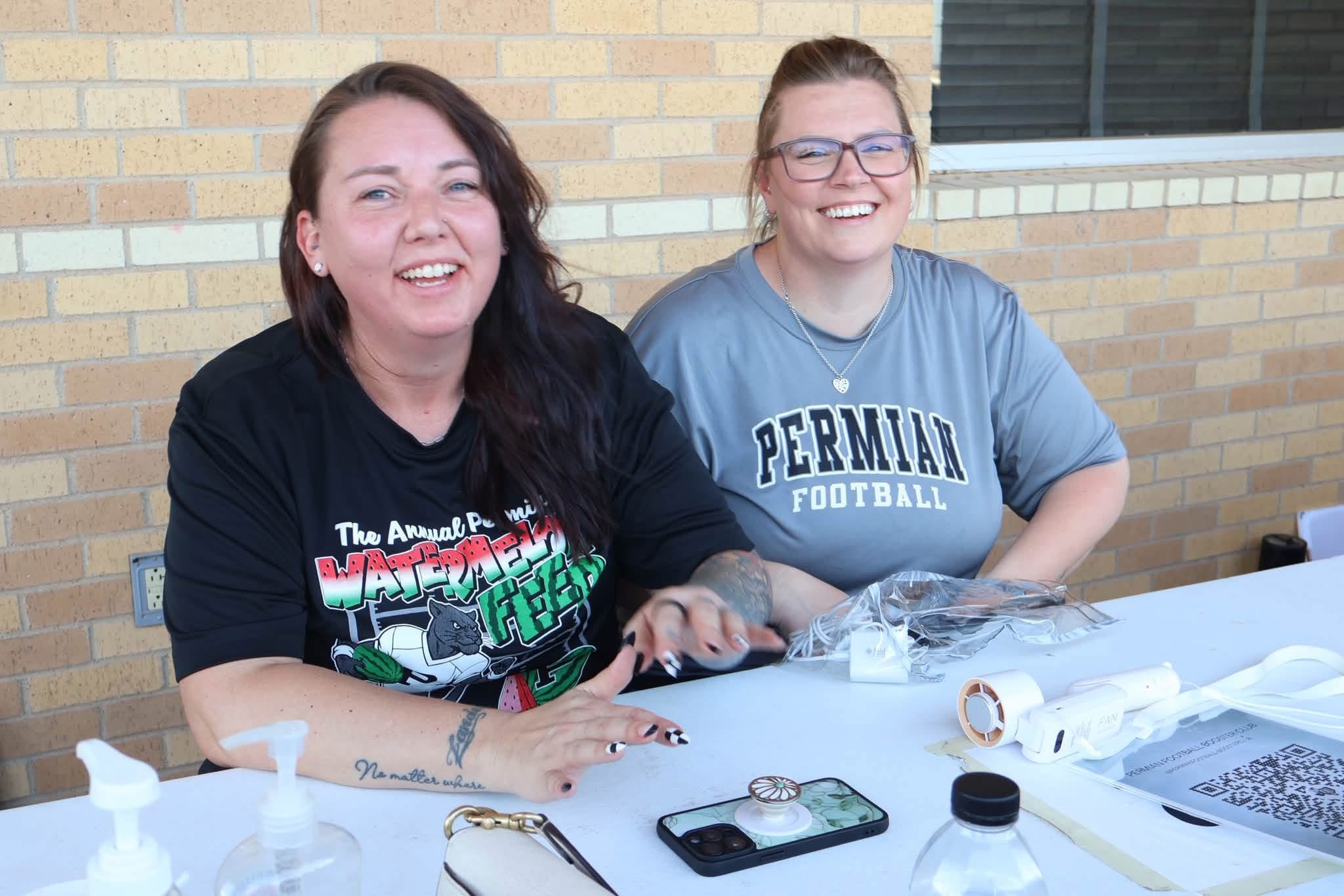 Permian Panthers booster club volunteers smiling